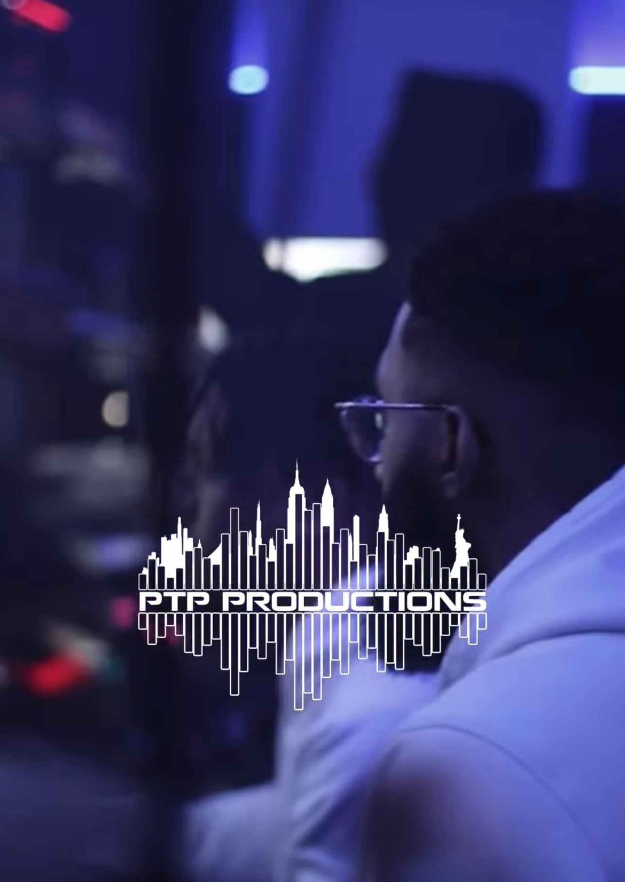 Producer at work in the studio with the PTP Productions wordmark overlaid